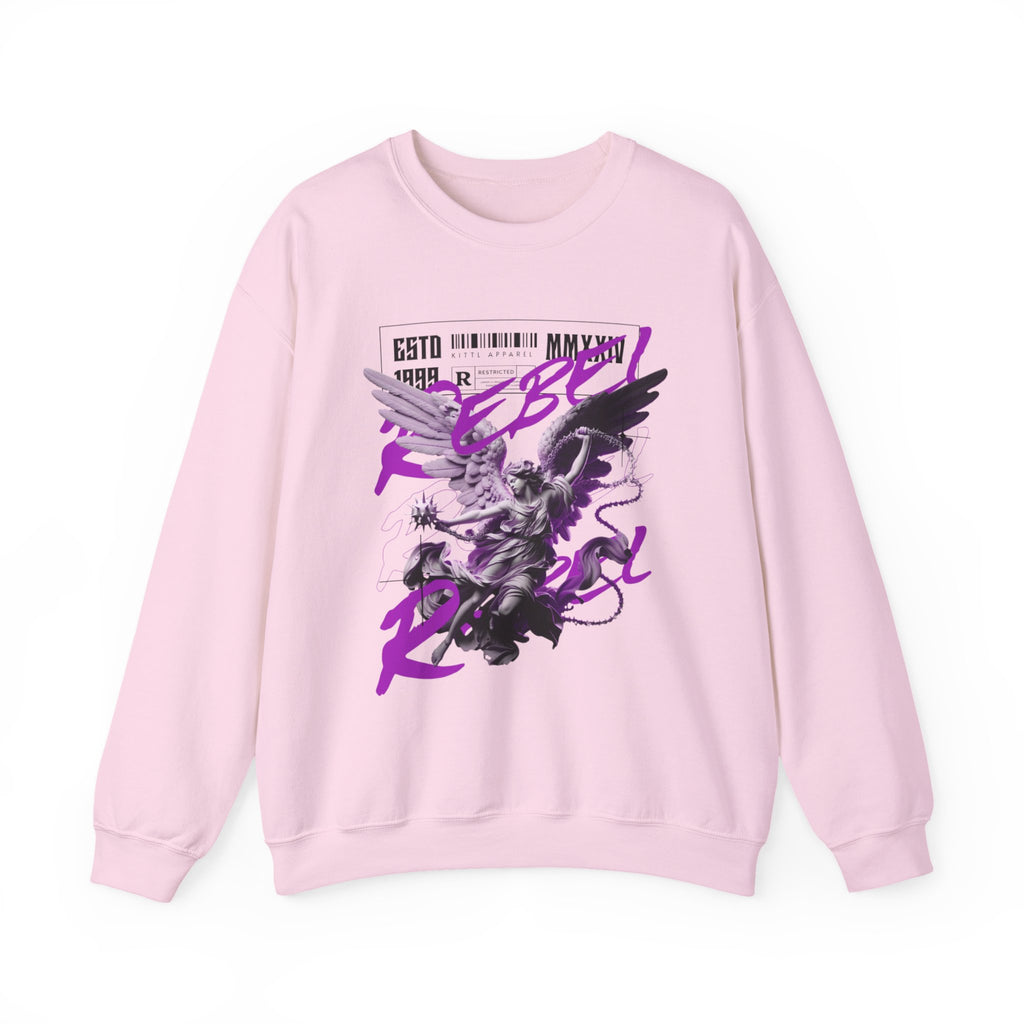 A light pink crewneck sweatshirt featuring a graphic print of a winged anime-style character and purple text reading 'Rebel Girl' on the front, set against a plain white background.